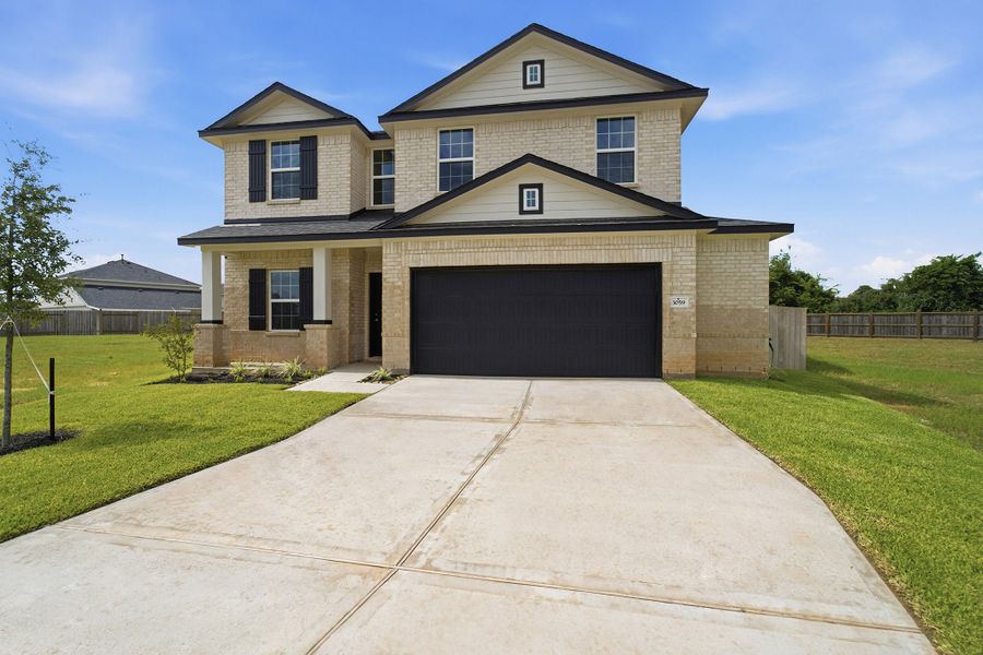 Front exterior of a new home in Bluestem, Brookshire, TX, highlighting curb appeal (Image 2).