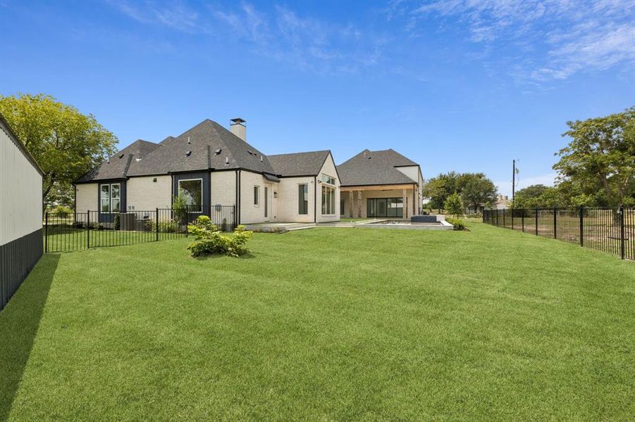 The 1,200 sf structure, near the main house, with a separate electric panel. Space for 4 more cars, boat, workshop, barn, etc. Endless possibilities! Horses allowed. NO HOA.