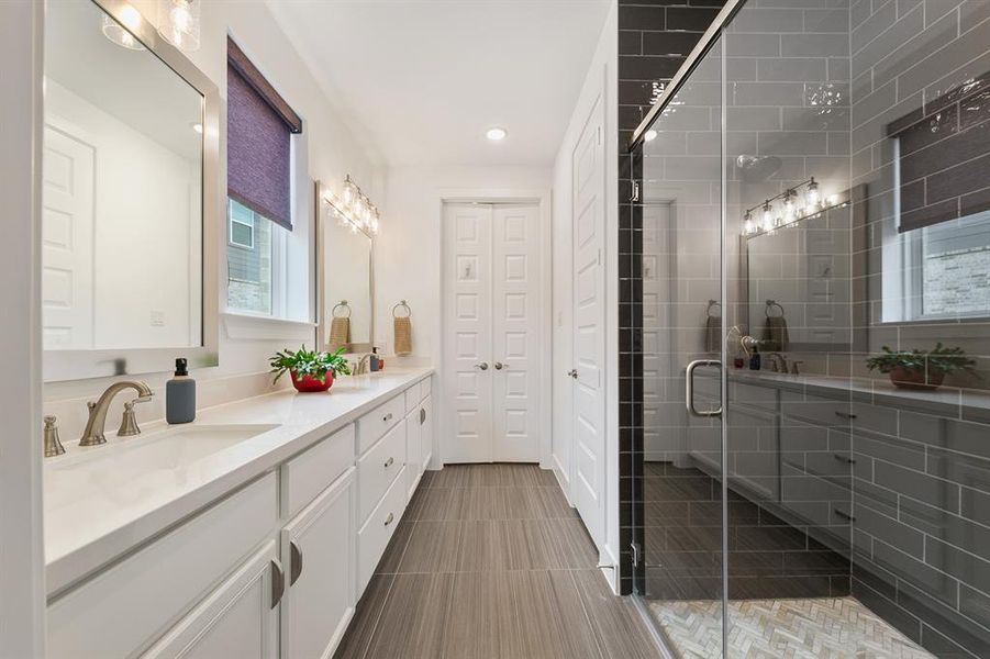 Extra-long vanity in the primary bath provides ample counter space and storage