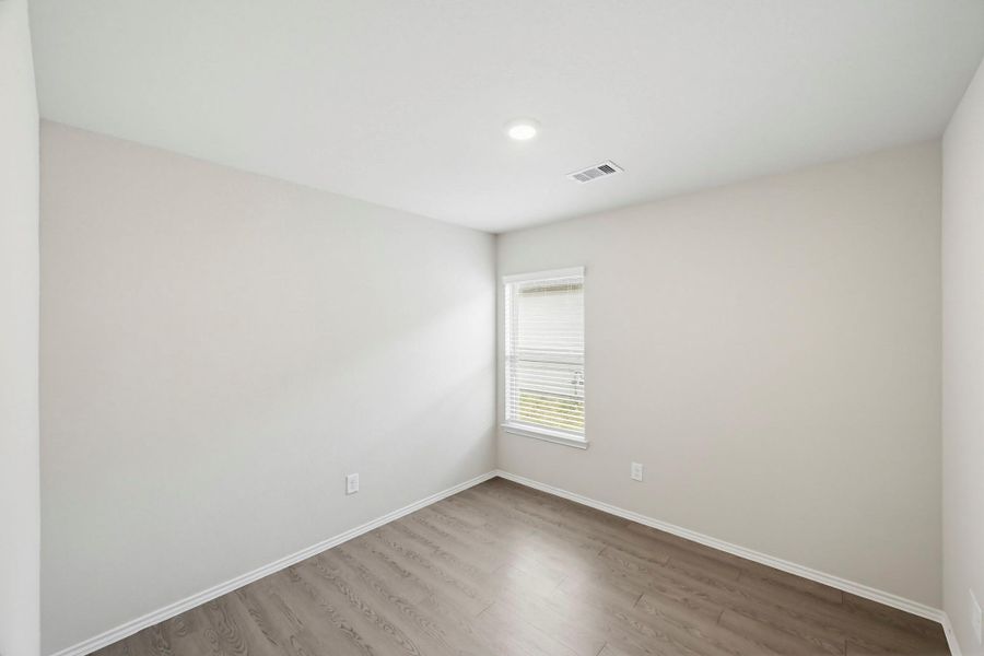 Bedroom #3. In this layout, all secondary bedrooms are away from the primary bedroom.