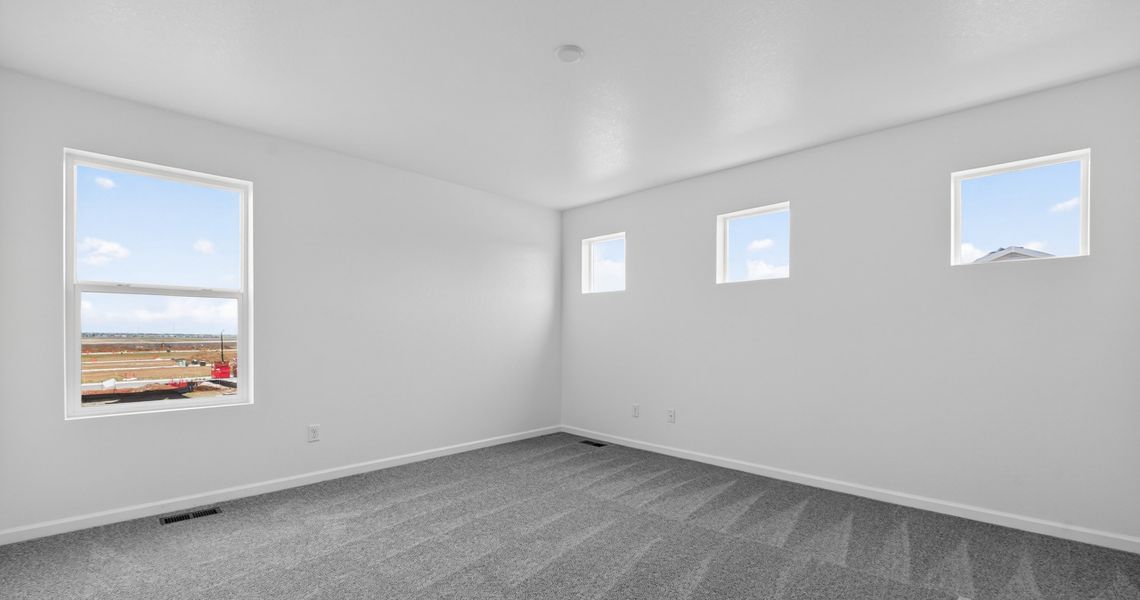 Spacious, unfurnished interior of a new home in Sky Ranch, Watkins (Image 16).