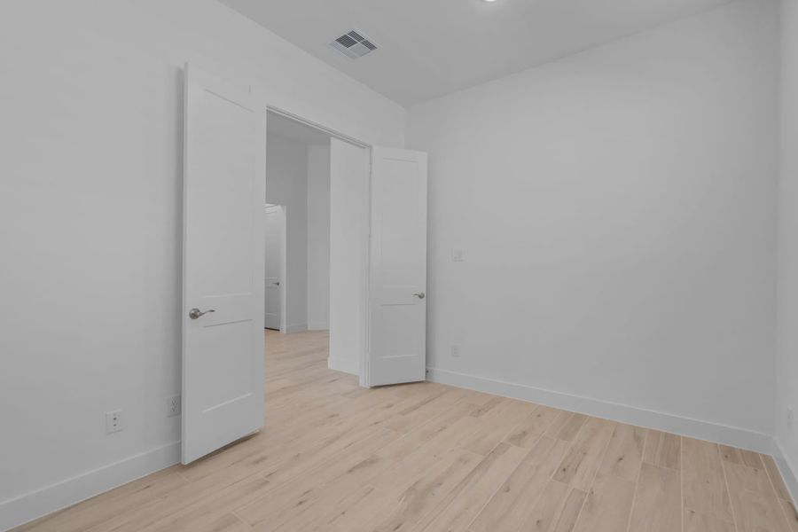 Representative unfurnished interior of a home built from the Lakeway by Chesmar Homes in Meridiana 50's, Manvel (Image 43).