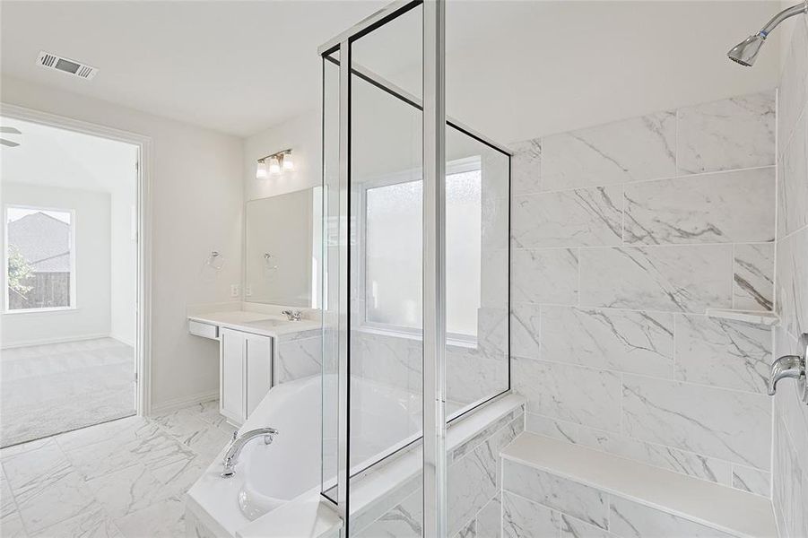 Bathroom with vanity and plus walk in shower