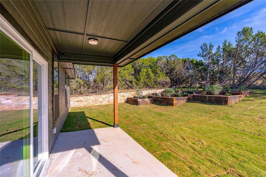 View of yard with a patio