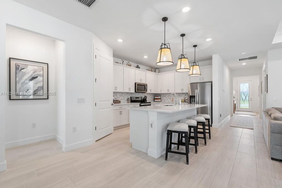 Furnished interior view inside a new home in Del Webb Naples, Ave Maria (Image 17).