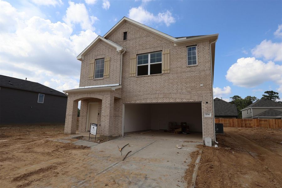 Front exterior of a new home in Indian Springs, Crosby, TX, highlighting curb appeal (Image 16).