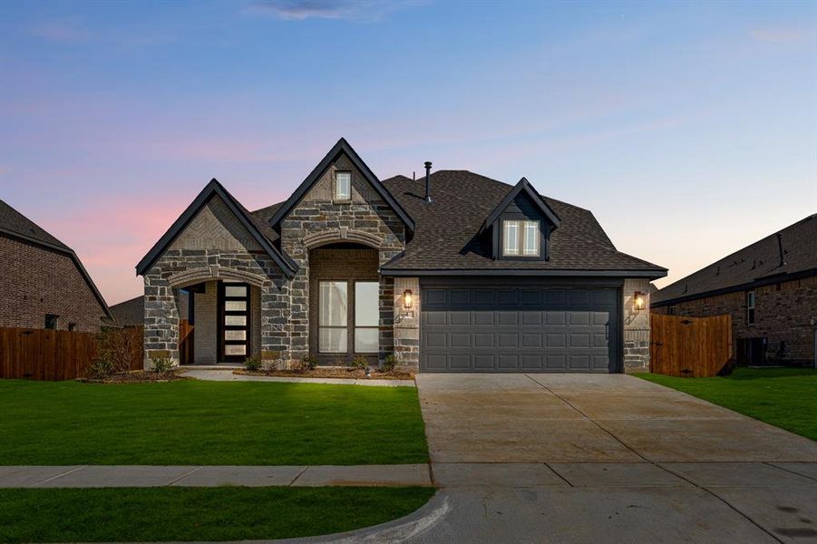 Front exterior of a new home in Sable Creek, Sanger, TX, highlighting curb appeal (Image 2).