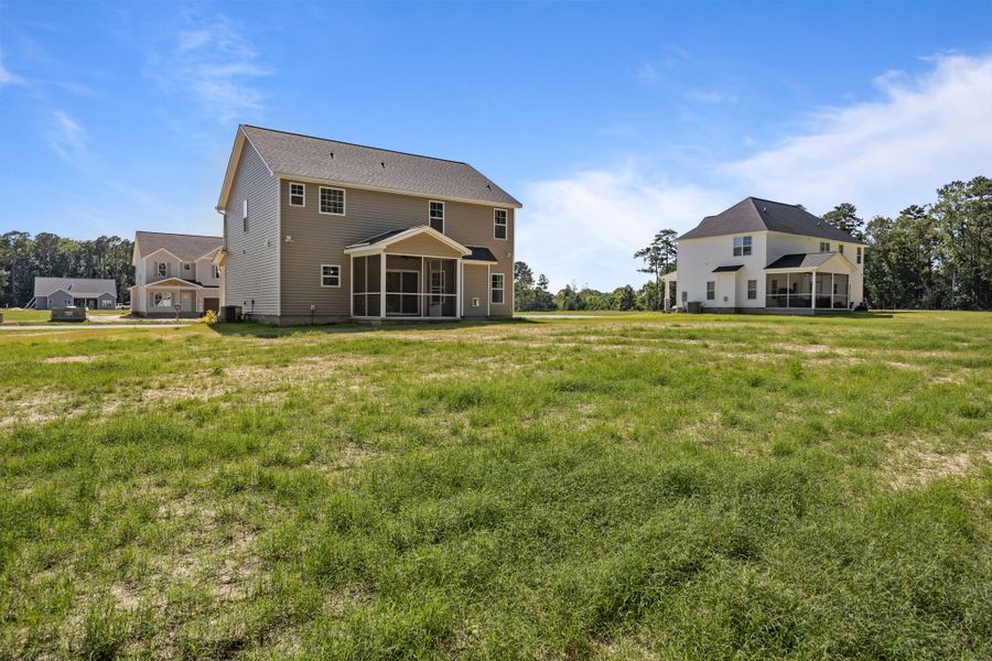 Front exterior of a new home in Laurel Oaks, Greenville, NC, highlighting curb appeal (Image 37). Front exterior of a new home in Laurel Oaks, Greenville, NC, highlighting curb appeal (Image 37).