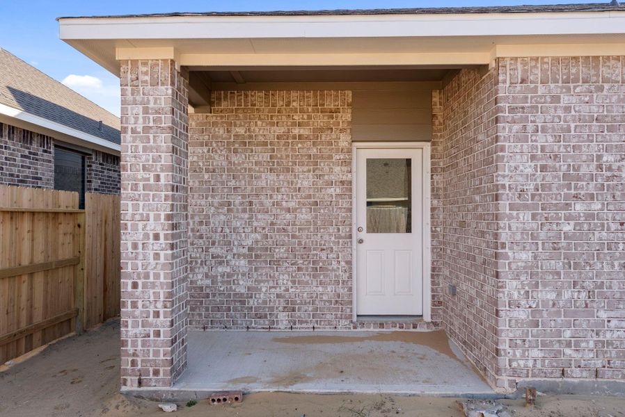 Exterior details and patio area of a home in Windrose Green, Angleton (Image 3).