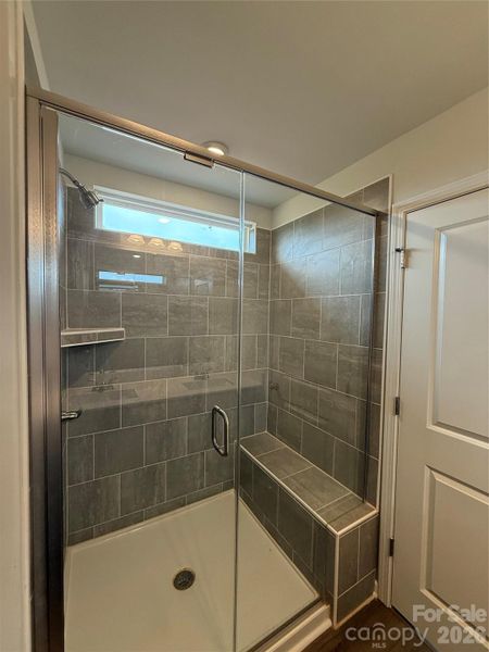 Tiled Shower with Bench and Shelve in Primary Bath