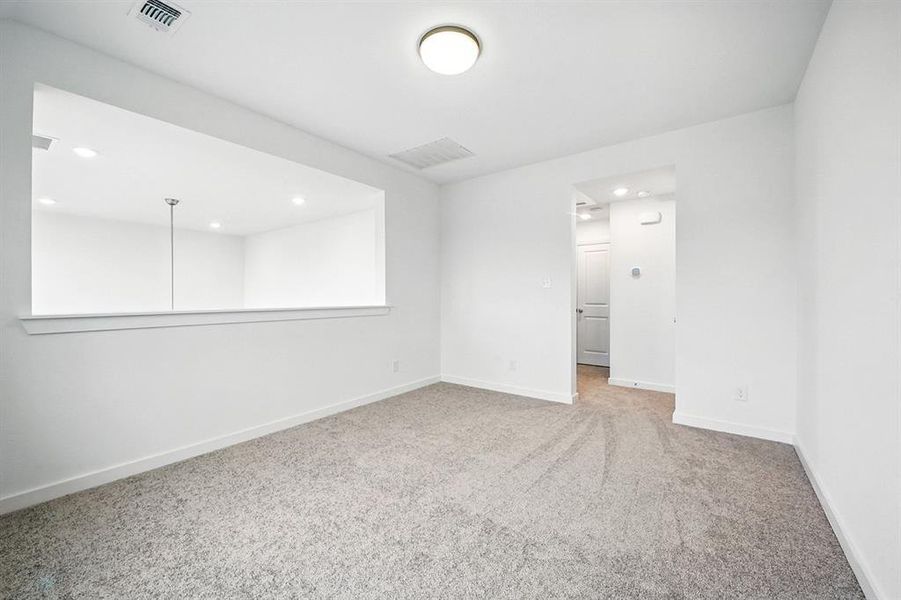 Spare room with light colored carpet and recessed lighting Spare room with light colored carpet and recessed lighting