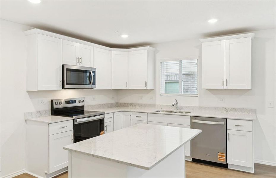 Spacious kitchen with eat-in bartop island