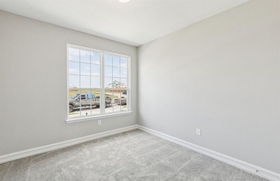 Spacious secondary bedroom with large windows