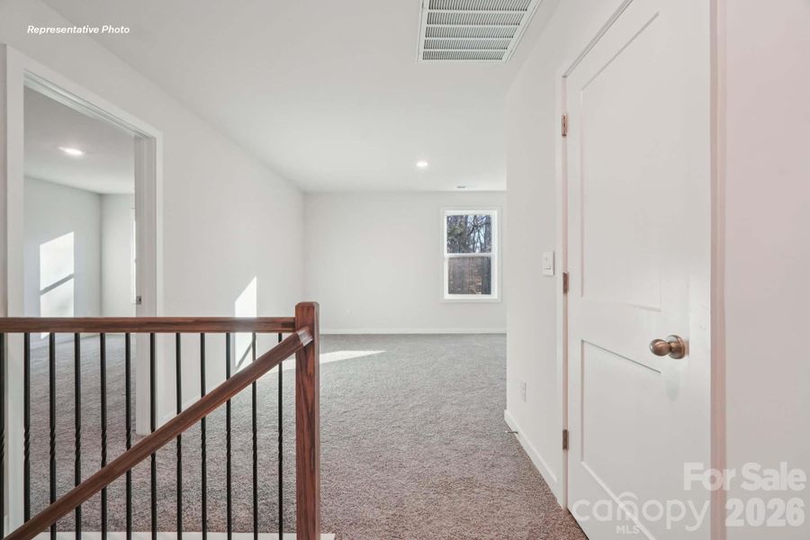 Spacious, unfurnished interior of a new home in Sanctuary at Southgate, Indian Trail (Image 17).