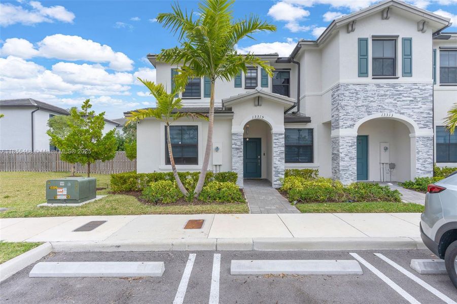 Front exterior of a new home in , Homestead, FL, highlighting curb appeal (Image 22).