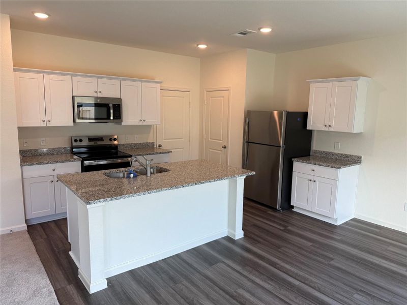 Furnished interior view inside a new home in Royal Pines, Porter (Image 7).
