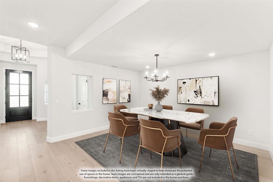 Dining room with marble table, tan chairs, chandelier, and light hardwood floors