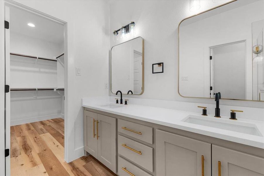 Bathroom with hardwood / wood-style floors and vanity