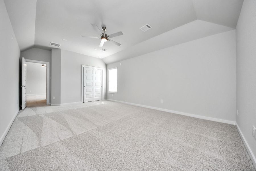 Generously sized secondary bedrooms featuring spacious closets, soft and inviting carpeting underfoot, large windows allowing plenty of natural light, and the added touch of privacy blinds for your personal retreat.