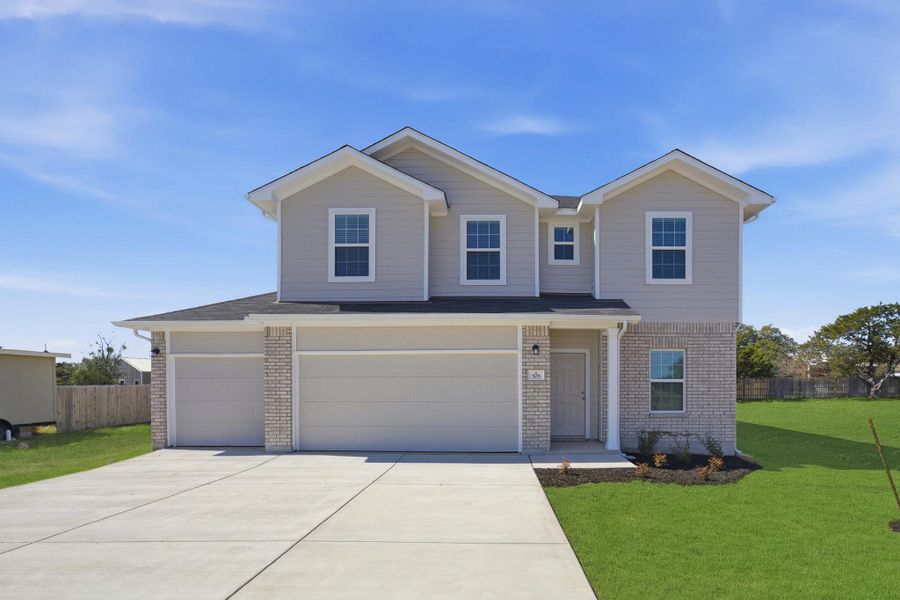 Front exterior of a new home in Grande Estates, Bertram, TX, highlighting curb appeal (Image 2).