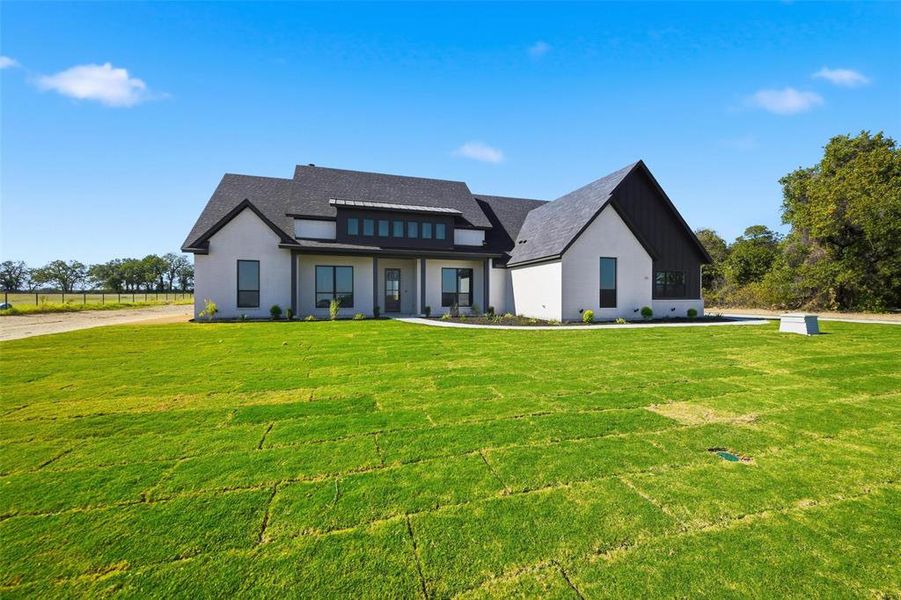 Front exterior of a new home in , Poolville, TX, highlighting curb appeal (Image 25).