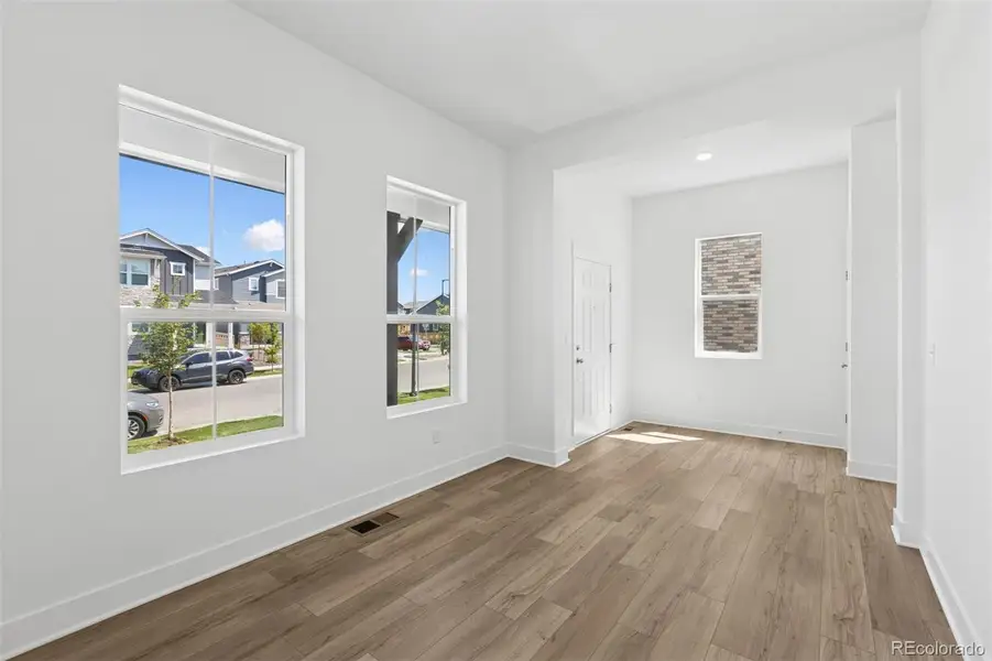 Spacious, unfurnished interior of a new home in Painted Prairie Cottage, Aurora (Image 33).
