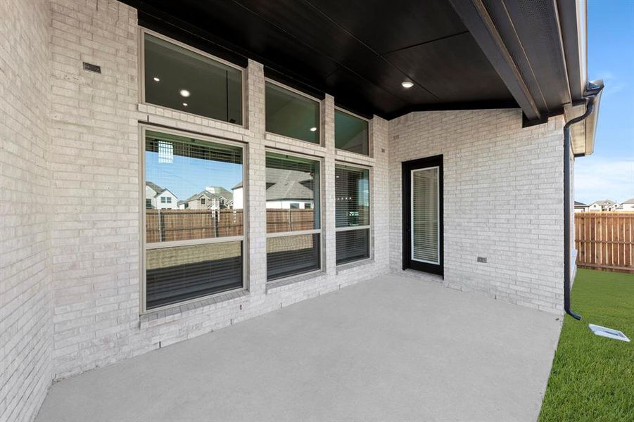 Exterior details and patio area of a home in Collinsbrook Farm, Frisco (Image 3).