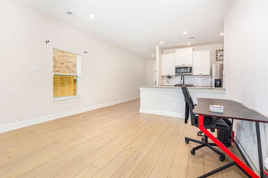 Office area featuring light wood-style flooring and recessed lighting Office area featuring light wood-style flooring and recessed lighting