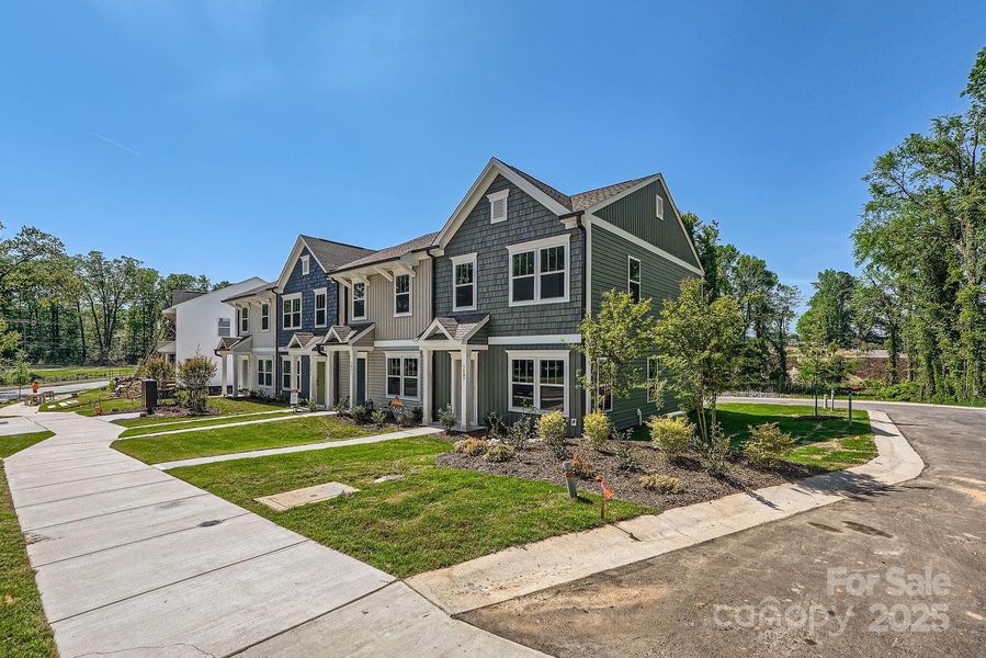 Front exterior of a new home in Dukes Ridge, Charlotte, NC, highlighting curb appeal (Image 1).