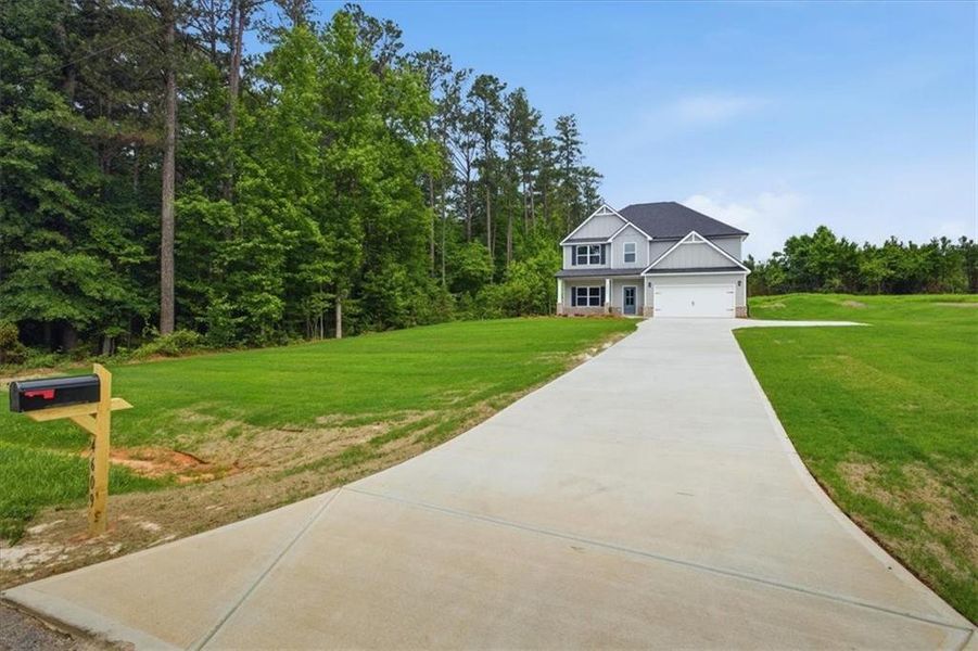 Front exterior of a new home in , Stockbridge, GA, highlighting curb appeal (Image 20). Front exterior of a new home in , Stockbridge, GA, highlighting curb appeal (Image 20).