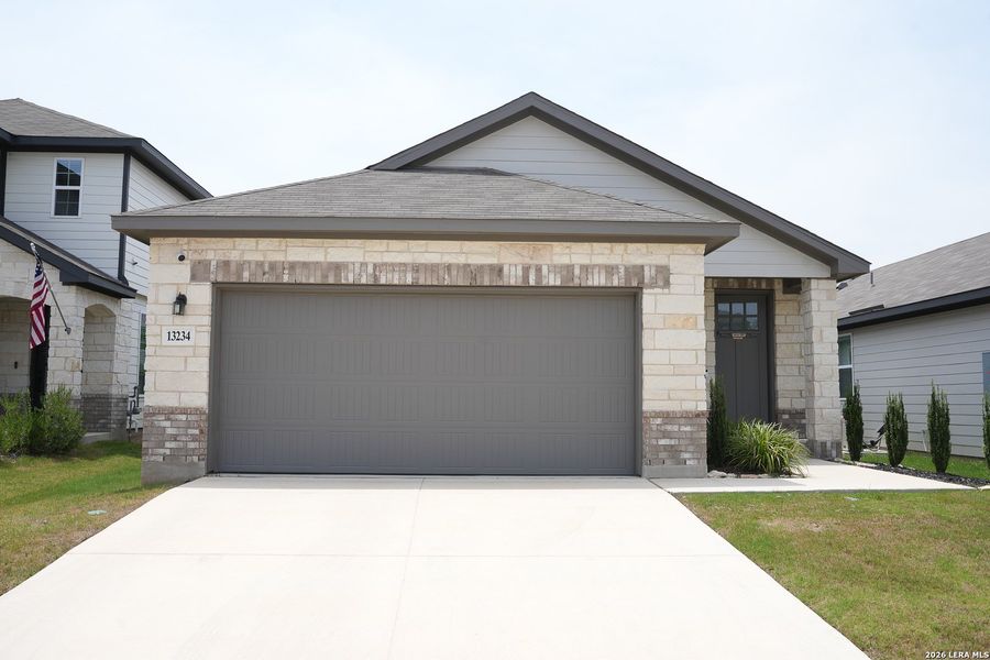 Front exterior of a new home in Veranda, San Antonio, TX, highlighting curb appeal (Image 2). Front exterior of a new home in Veranda, San Antonio, TX, highlighting curb appeal (Image 2).