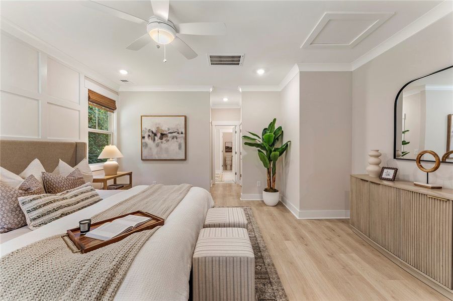 This spacious primary bedroom features natural lig This spacious primary bedroom features natural lig