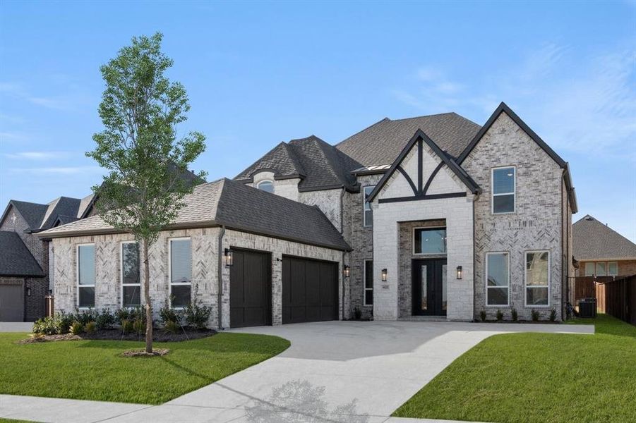 Front exterior of a new home in La Frontera, Fort Worth, TX, highlighting curb appeal (Image 2). Front exterior of a new home in La Frontera, Fort Worth, TX, highlighting curb appeal (Image 2).