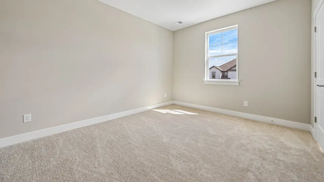 Bright and versatile bedroom designed to fit a variety of needs