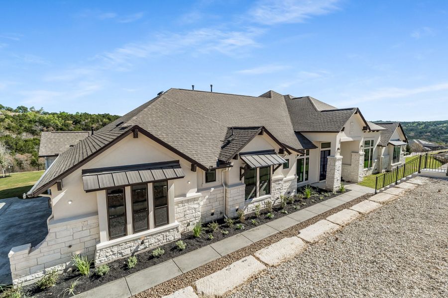 Representative exterior photo of a completed home built from the Coronado I by Giddens Homes in Clearwater Ranch, Liberty Hill, TX (Image 40).