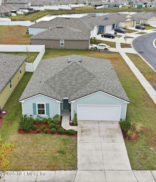 Front exterior of a new home in Cross Creek Express, Green Cove Springs, FL, highlighting curb appeal (Image 23). Front exterior of a new home in Cross Creek Express, Green Cove Springs, FL, highlighting curb appeal (Image 23).