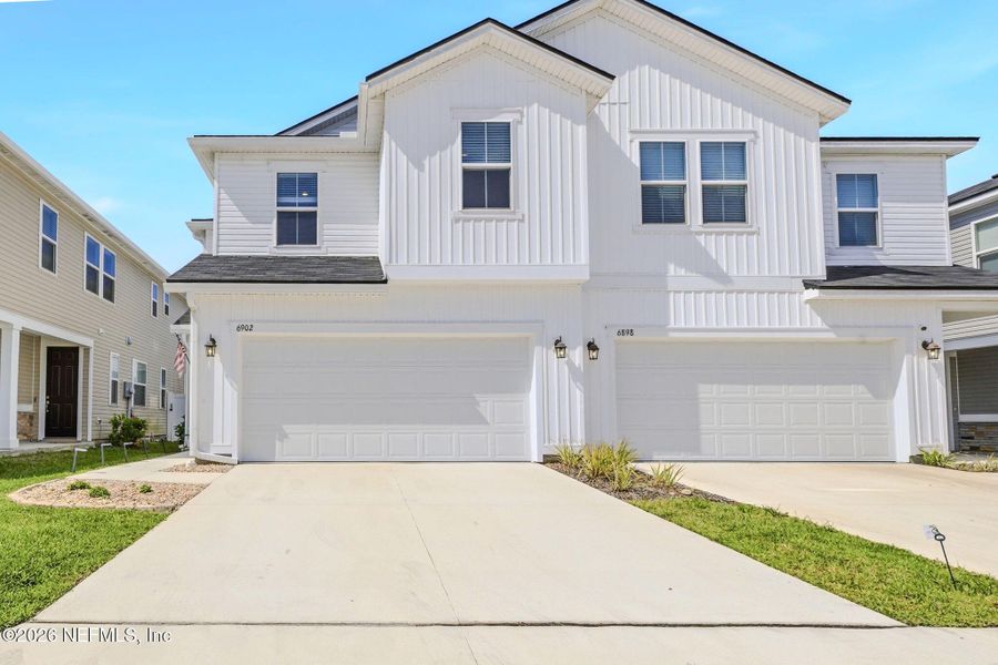 Front exterior of a new home in , Jacksonville, FL, highlighting curb appeal (Image 23).