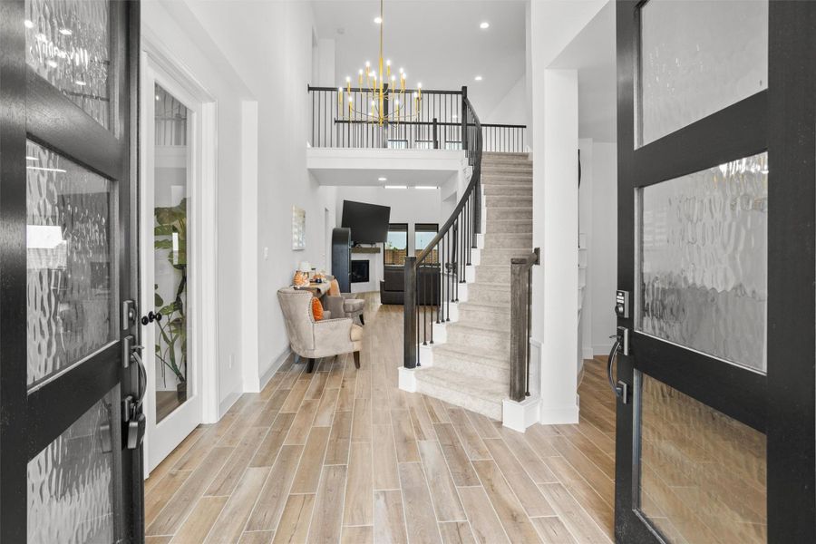 Grand two-story entry with curved staircase