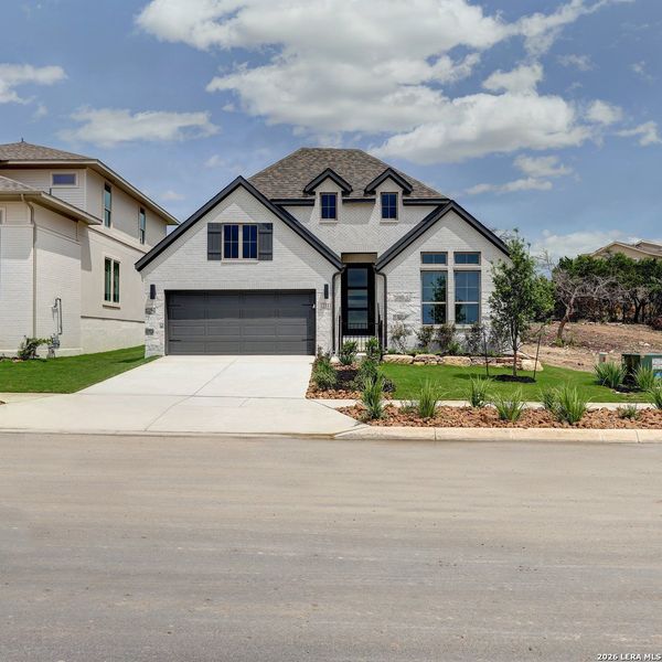 Front exterior of a new home in Esperanza, Boerne, TX, highlighting curb appeal (Image 1). Front exterior of a new home in Esperanza, Boerne, TX, highlighting curb appeal (Image 1).