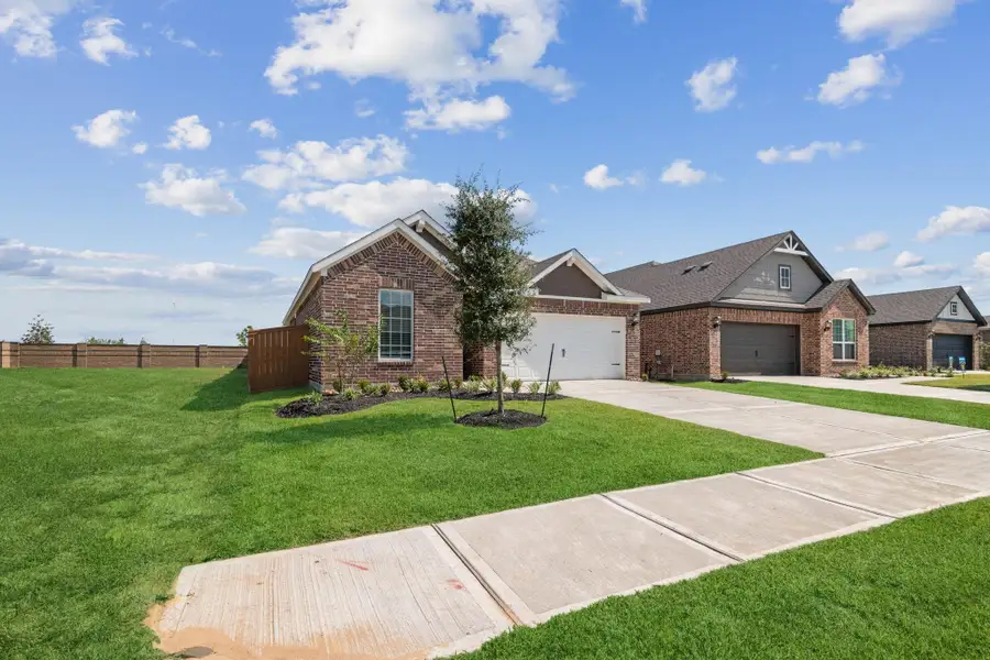 Front exterior of a new home in Emberly, Beasley, TX, highlighting curb appeal (Image 1). Front exterior of a new home in Emberly, Beasley, TX, highlighting curb appeal (Image 1).