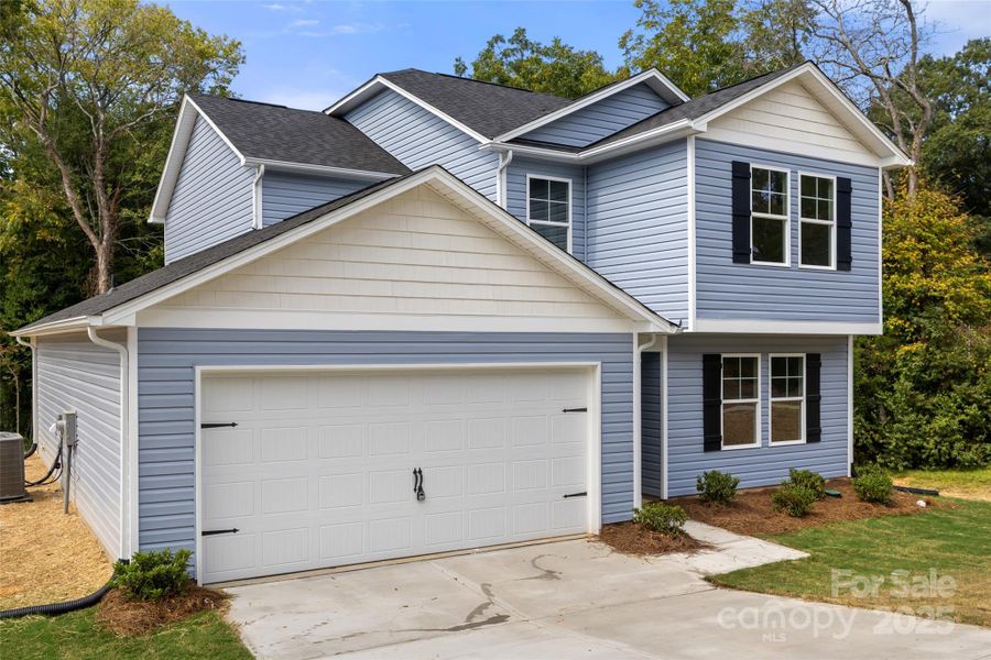 Front exterior of a new home in , Lancaster, SC, highlighting curb appeal (Image 22).