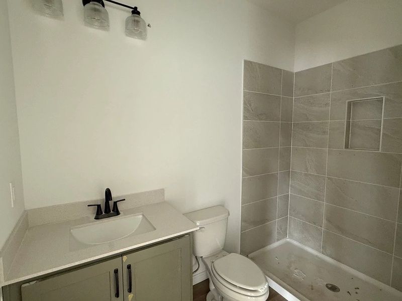 Guest Bath featuring the AW Collection® Rosemary - Garden hues and clean finishes invite calm.