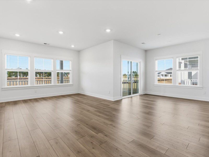 Spacious, unfurnished interior of a new home in The Coves at Lakes of Cane Bay, Summerville (Image 24).