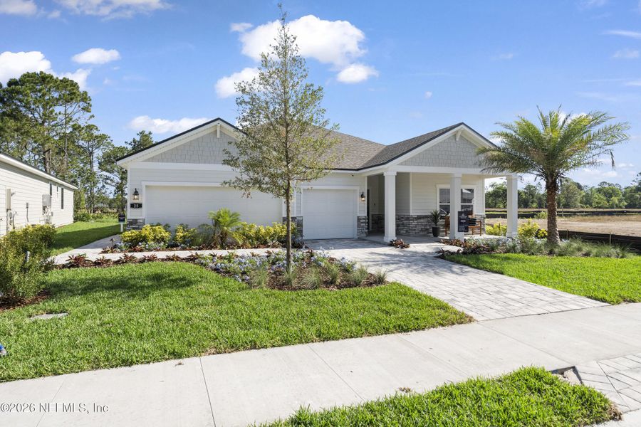 Front exterior of a new home in Reserve East, Flagler Beach, FL, highlighting curb appeal (Image 26). Front exterior of a new home in Reserve East, Flagler Beach, FL, highlighting curb appeal (Image 26).