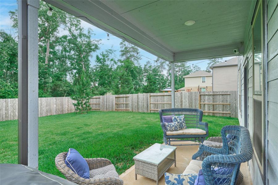 Exterior details and patio area of a home in The Pines At Seven Coves, Willis (Image 3).