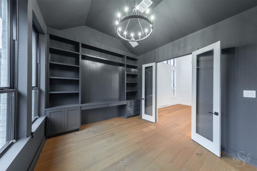 Office with custom paint, built-ins, and upgraded chandelier. Located downstairs. Office with custom paint, built-ins, and upgraded chandelier. Located downstairs.