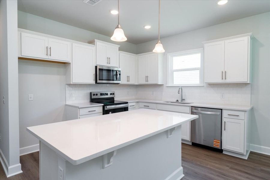 Open Kitchen with white cabinets and granite countertops. Open Kitchen with white cabinets and granite countertops.