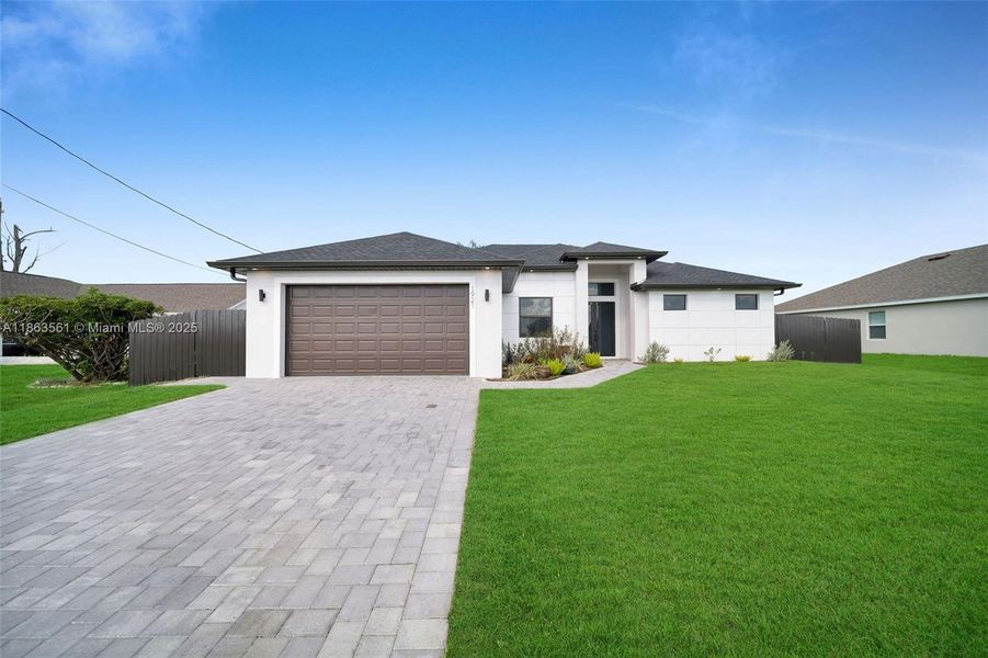 Front exterior of a new home in , Cape Coral, FL, highlighting curb appeal (Image 2).