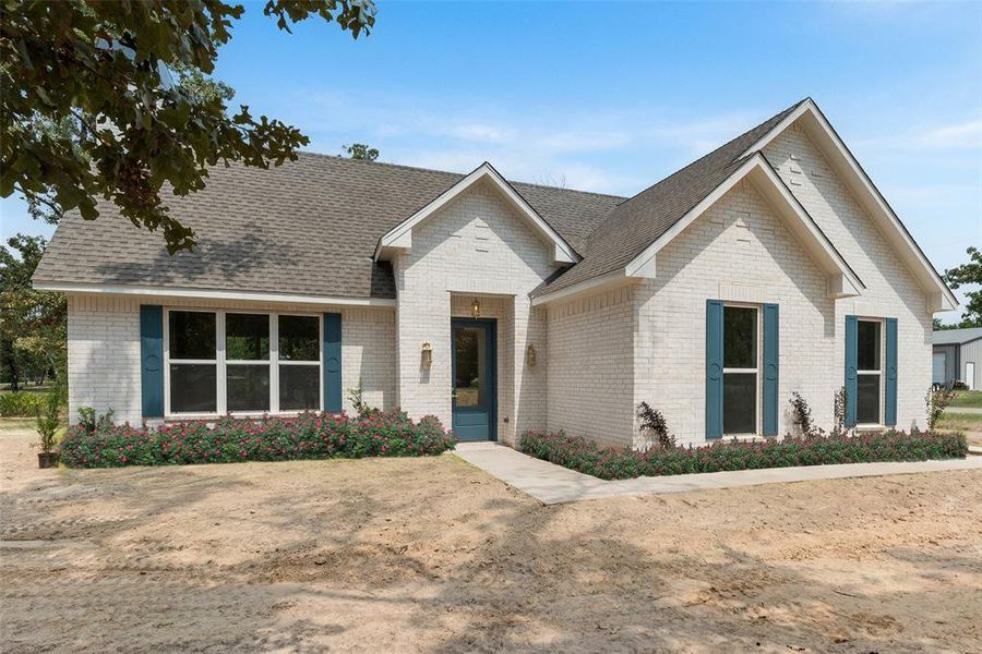 Roses in the photo are a visual representation and not physically present on the property.