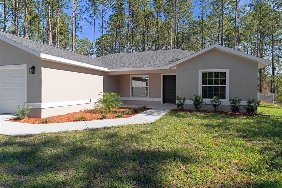 Front exterior of a new home in , Citrus Springs, FL, highlighting curb appeal (Image 26).